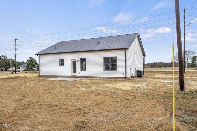 back of house featuring central AC unit and a patio