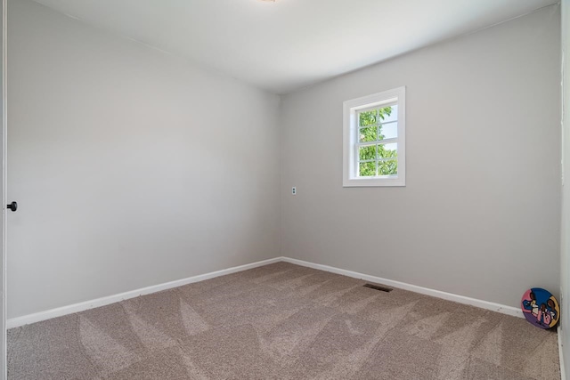 unfurnished room featuring carpet flooring