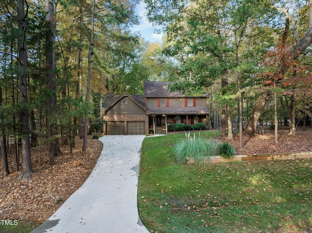 view of front of house with a garage and a front yard