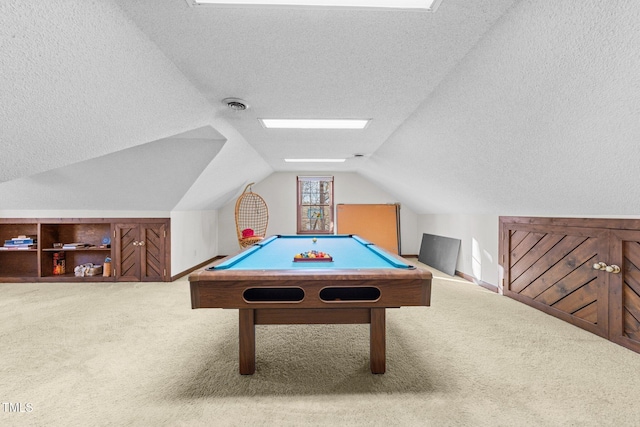 recreation room with billiards, vaulted ceiling, carpet, and a textured ceiling