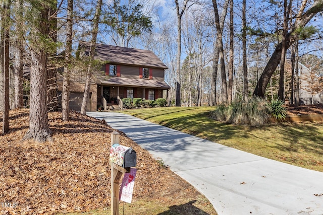 view of front property with covered porch and a front lawn