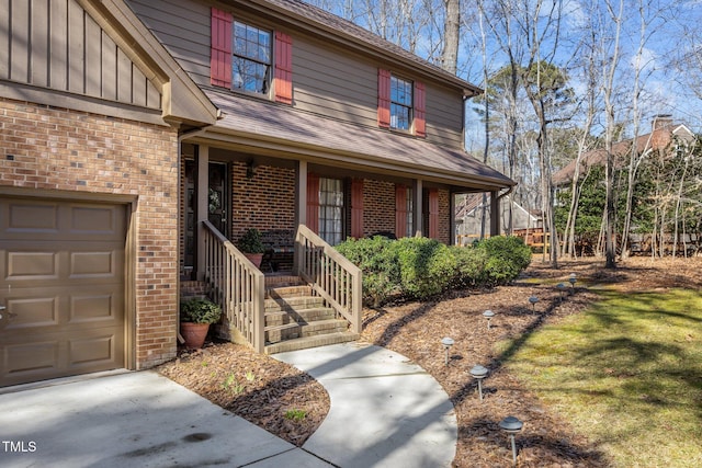 view of front of home with a garage and a porch