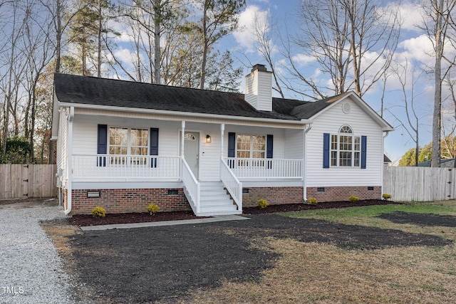 single story home with a porch