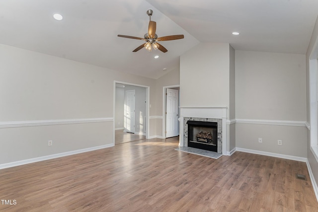 unfurnished living room featuring a brick fireplace, high vaulted ceiling, light hardwood / wood-style floors, and ceiling fan