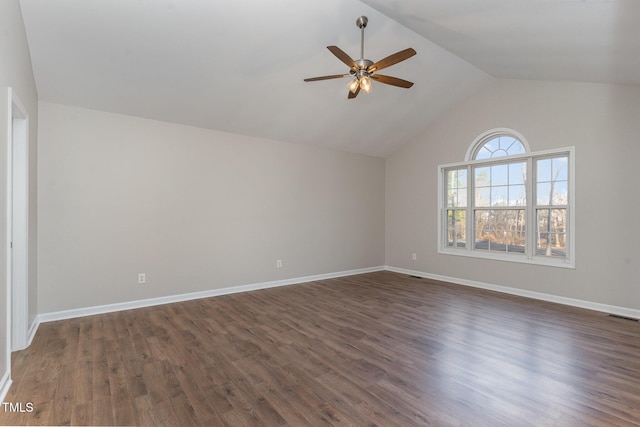 unfurnished room featuring vaulted ceiling, dark hardwood / wood-style floors, and ceiling fan