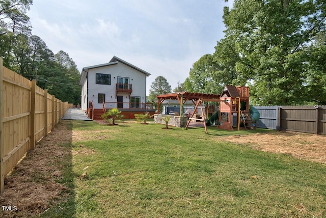 view of yard featuring a playground and a deck