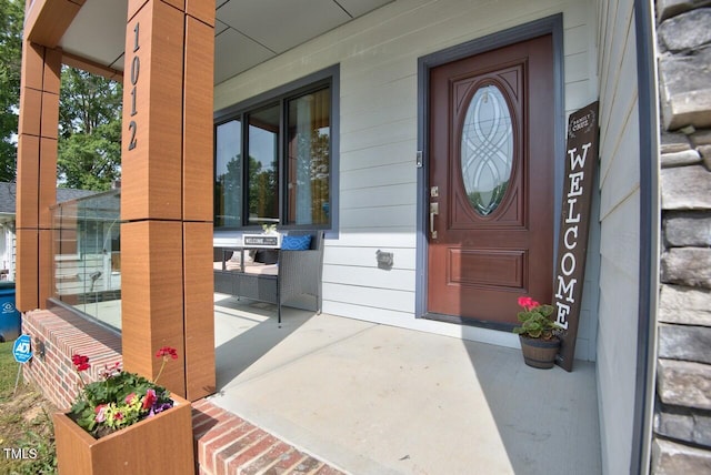 property entrance featuring covered porch