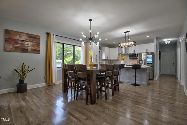 dining space featuring dark wood-type flooring and a notable chandelier