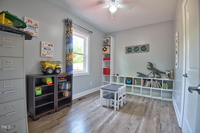 playroom featuring ceiling fan and light wood-type flooring