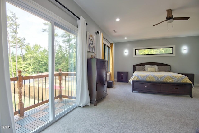 bedroom with light colored carpet and access to exterior