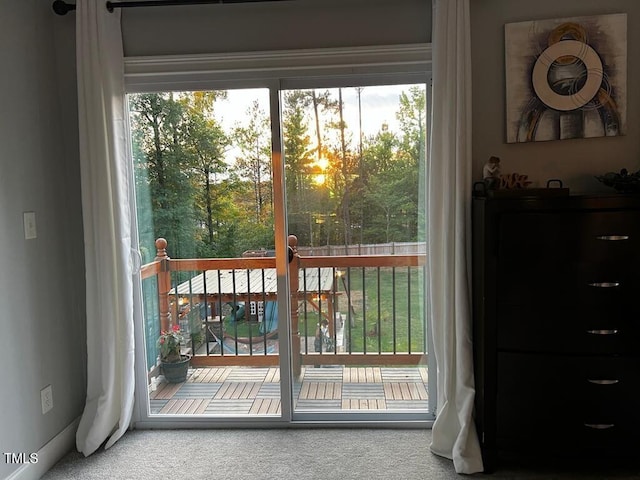 doorway with carpet flooring