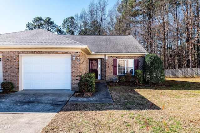 view of front of home with a garage and a front lawn