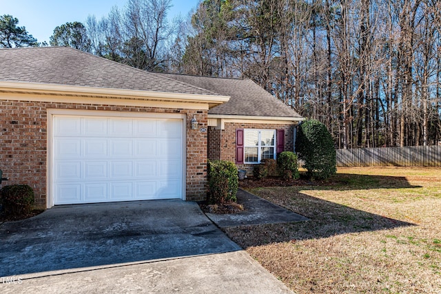 view of front facade with a garage and a front yard