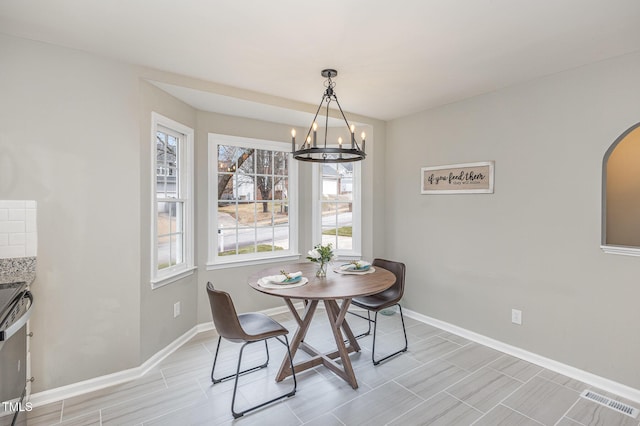 dining room with a notable chandelier