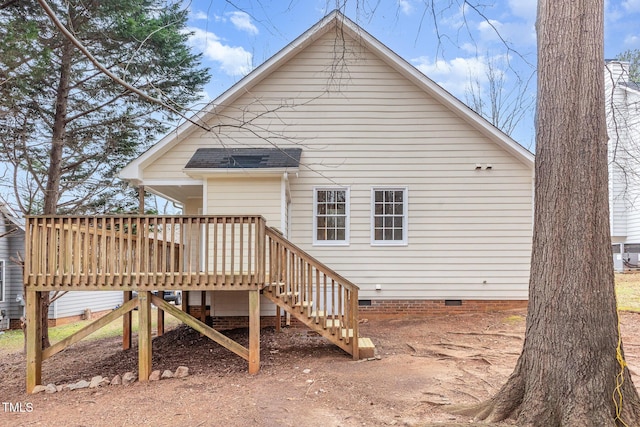 back of property featuring a deck