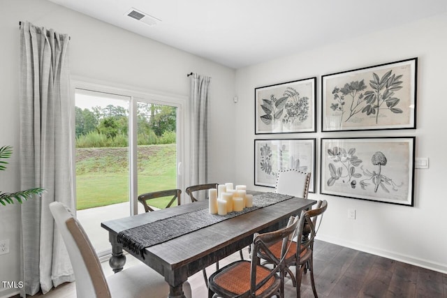 dining space featuring dark wood-type flooring