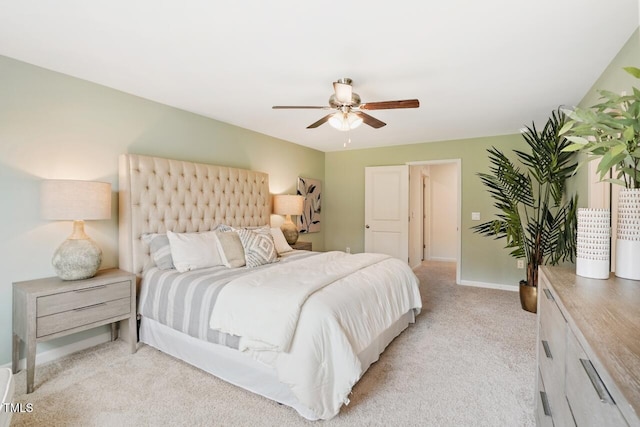 bedroom with light carpet and ceiling fan