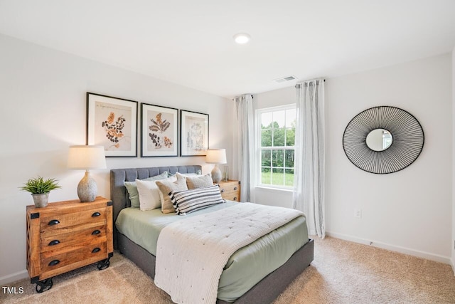 bedroom with light carpet