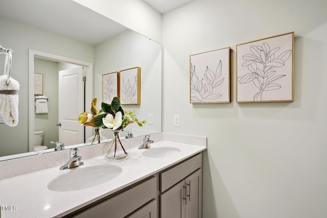 bathroom with vanity and toilet