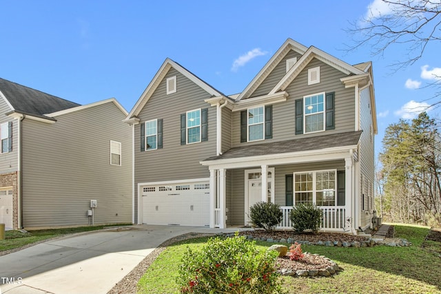 view of front of house with a garage and covered porch