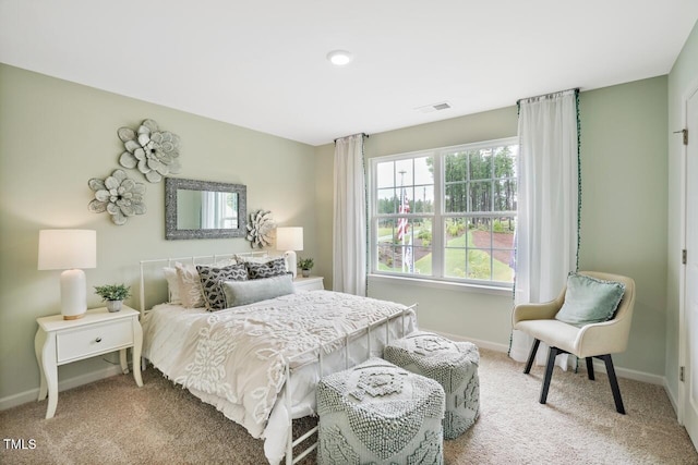 bedroom featuring light colored carpet