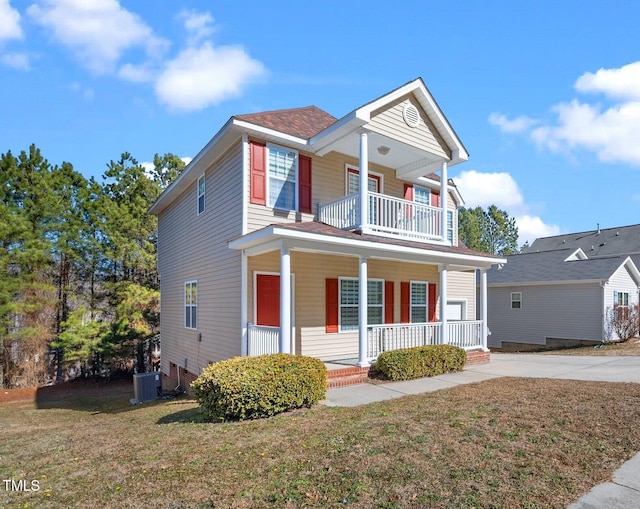 view of front of house featuring a balcony, a front yard, central air condition unit, and covered porch