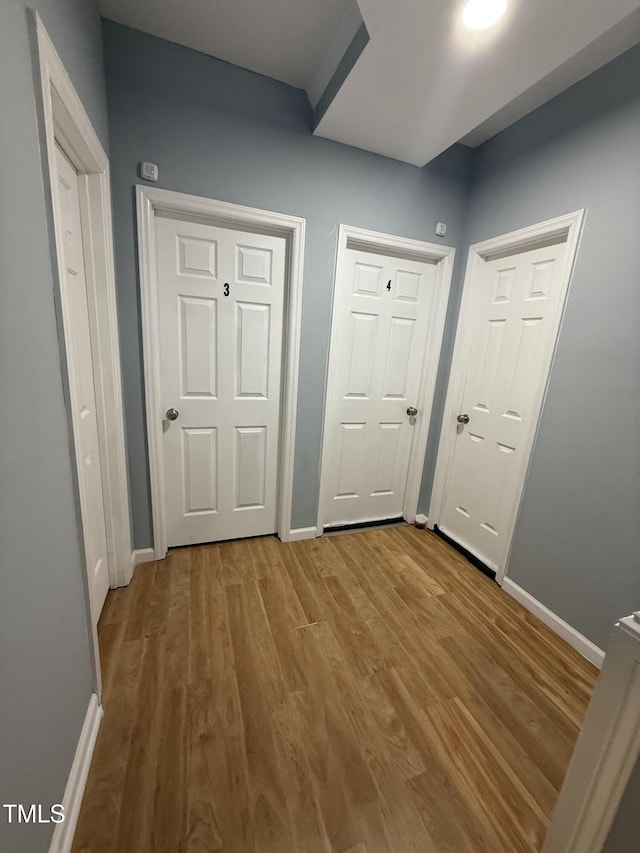 unfurnished bedroom with hardwood / wood-style floors