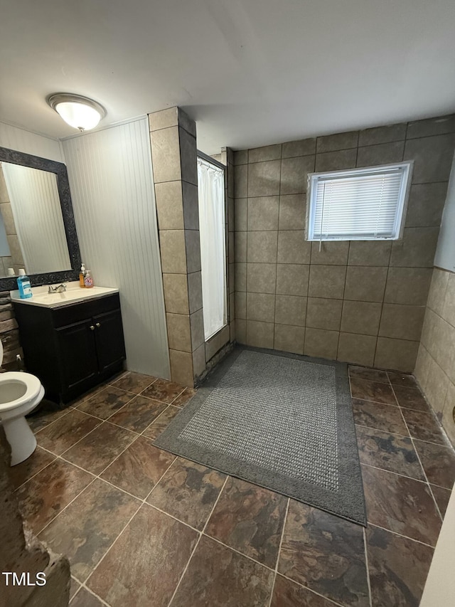 bathroom featuring vanity and a shower with shower curtain