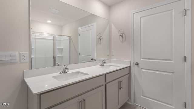 bathroom with vanity and an enclosed shower