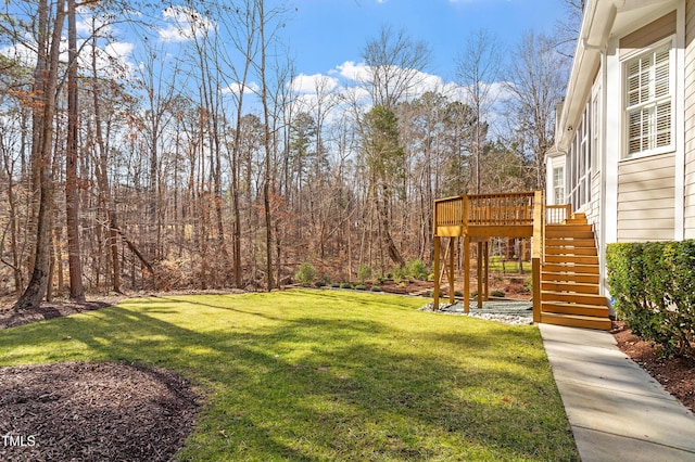 view of yard featuring a wooden deck