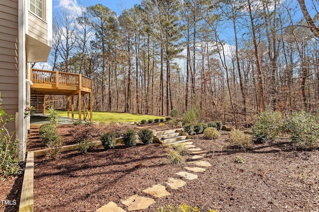 view of yard with a wooden deck