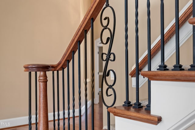 stairway featuring hardwood / wood-style flooring