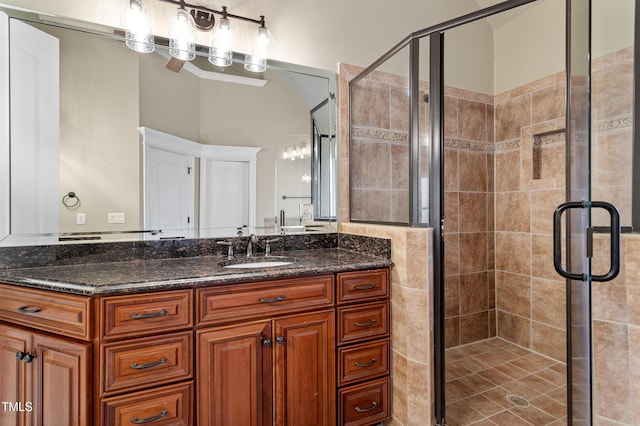 bathroom with walk in shower and vanity