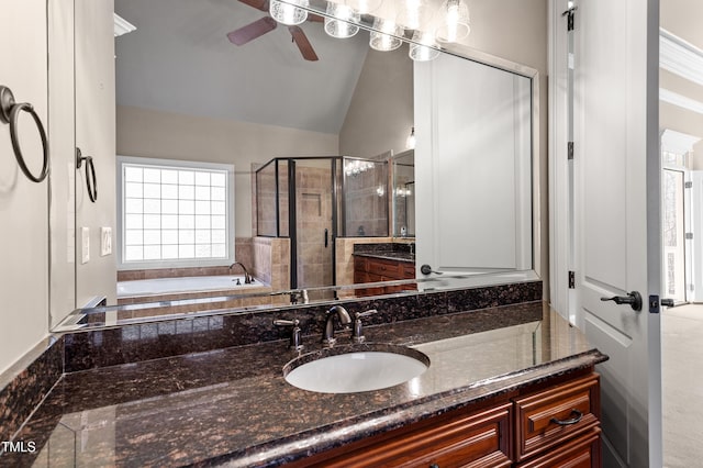 bathroom featuring ceiling fan, lofted ceiling, vanity, and separate shower and tub