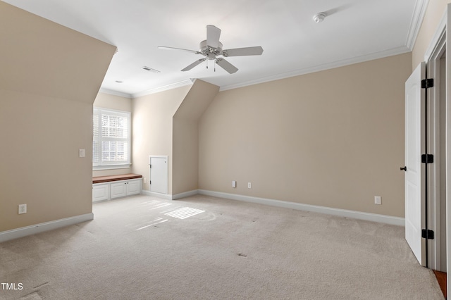 additional living space with ceiling fan and light carpet