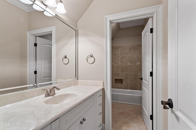 bathroom featuring vanity, tile patterned flooring, and lofted ceiling