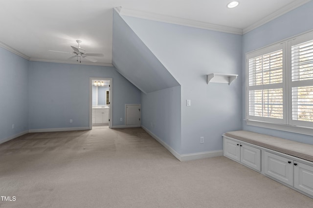 additional living space with light colored carpet and ceiling fan