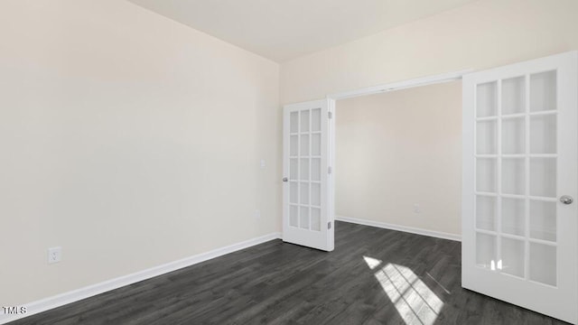 unfurnished room with dark wood-type flooring and french doors