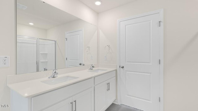 bathroom with vanity and walk in shower