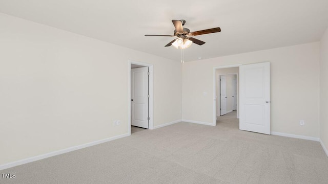 empty room with light colored carpet and ceiling fan