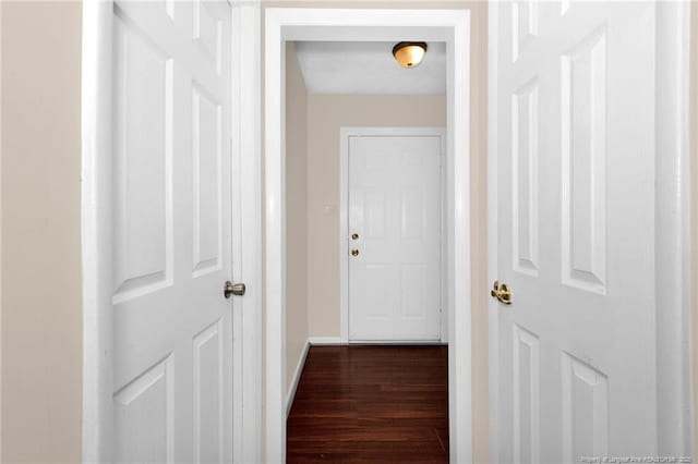 hallway featuring dark hardwood / wood-style floors