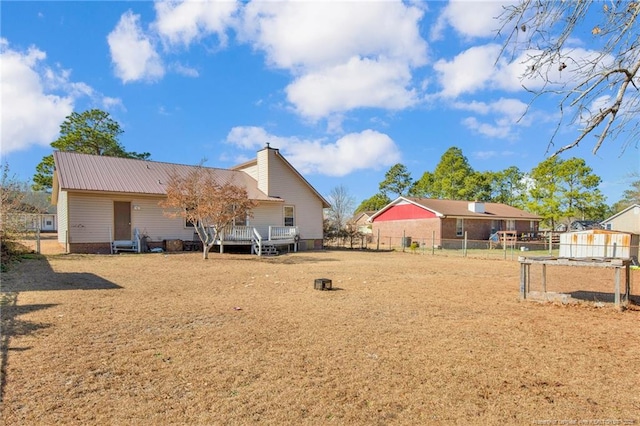 back of property featuring a wooden deck