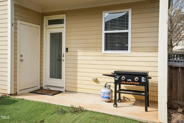 entrance to property with a patio