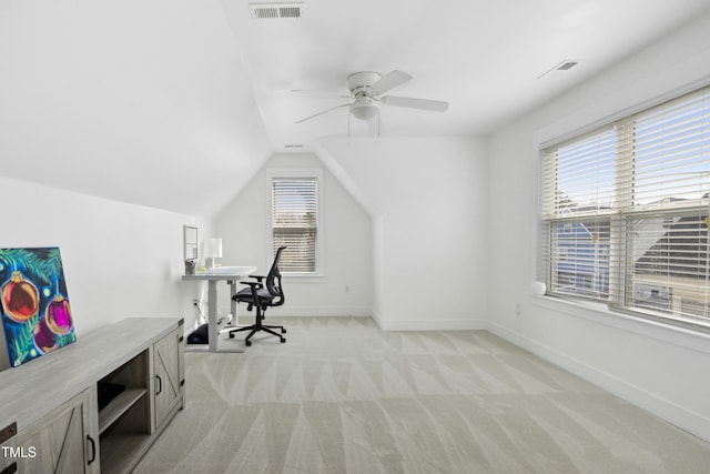 office space featuring lofted ceiling, light colored carpet, and ceiling fan