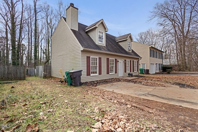 view of front of house with a garage and a patio area