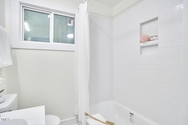 bathroom with shower / bath combination with curtain and toilet