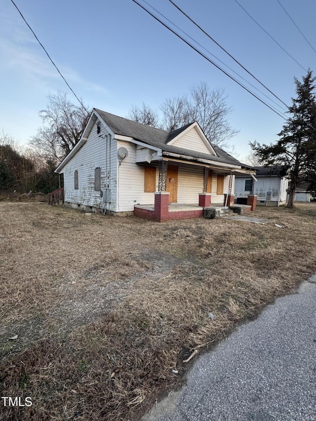 ranch-style home with covered porch