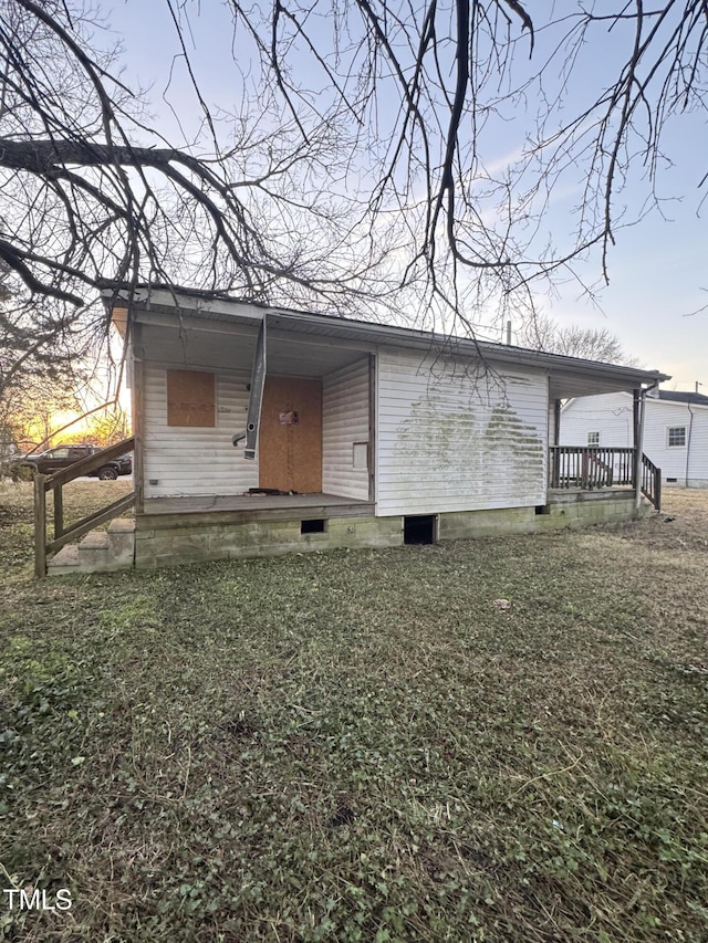 back house at dusk with a yard