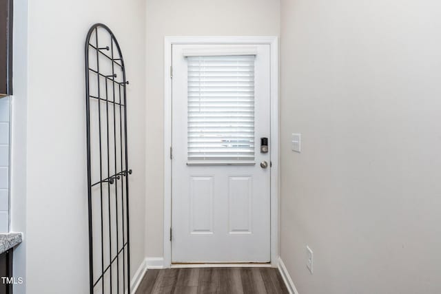 doorway with dark wood-type flooring