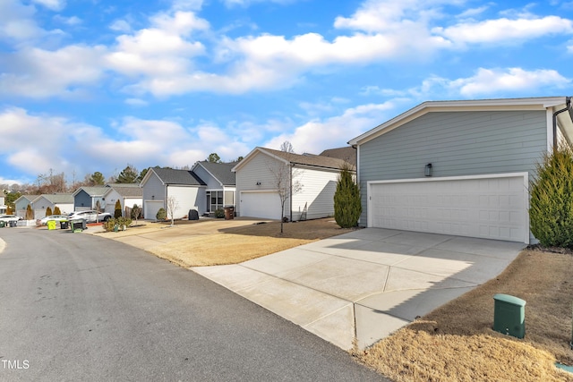 view of front of house featuring a garage and a residential view